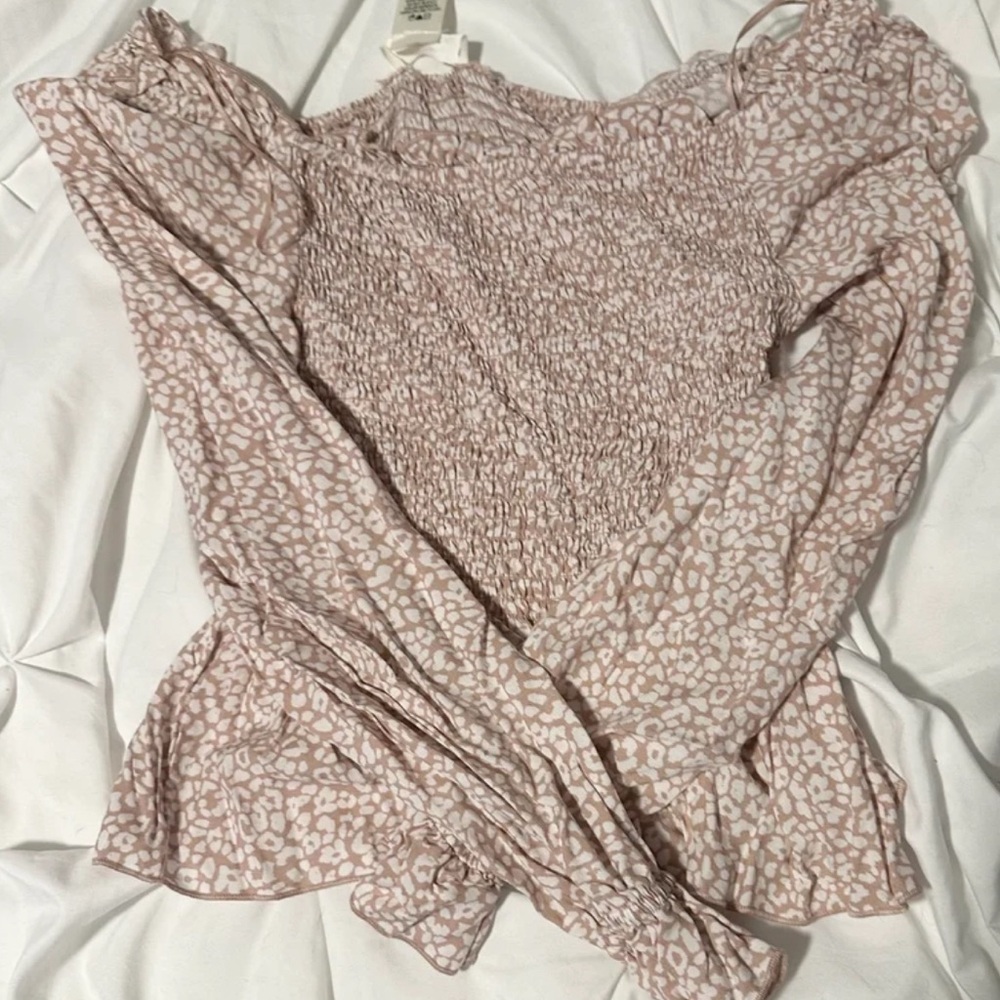 Woman’s pink top